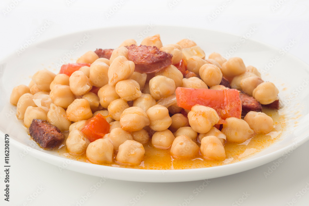 homemade chickpea and chorizo stew on plate homemade chickpea and chorizo stew on plate