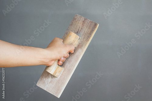 
plasterer concrete worker at wall of house construction