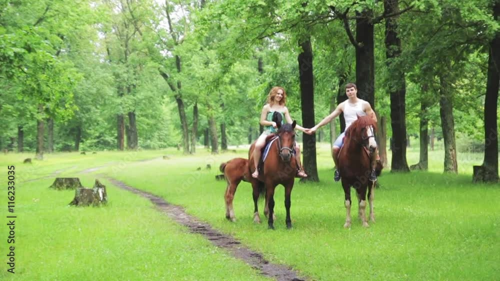 Lovers ride horses in the park, Slow Motion Lovers ride horses in the park, Slow Motion