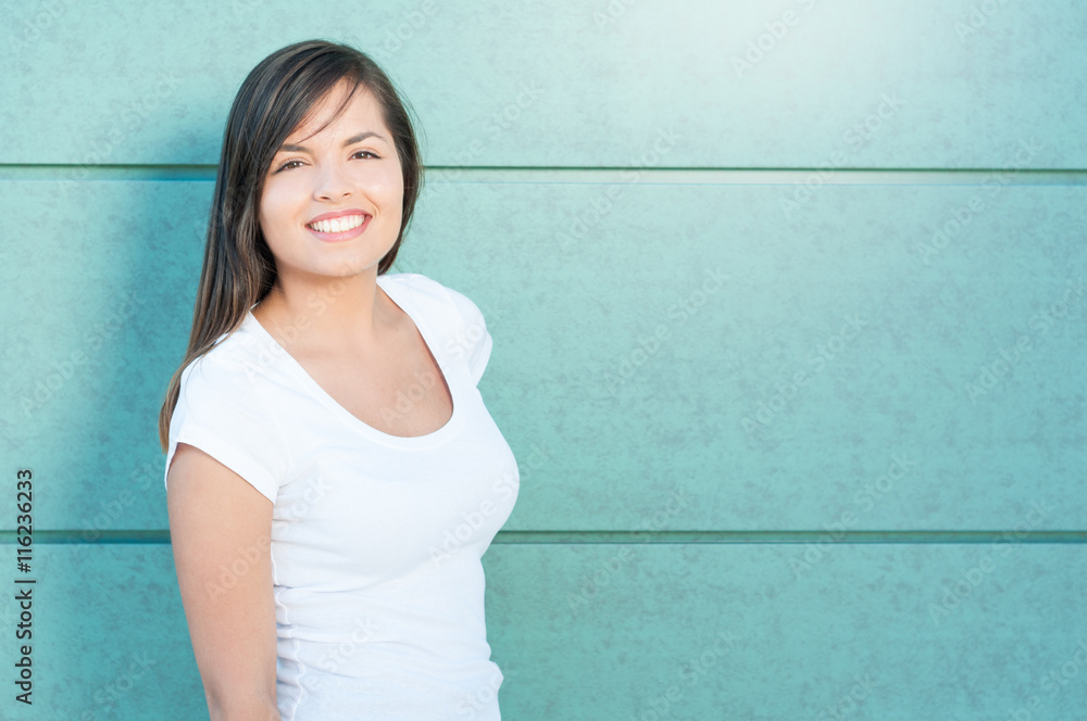 Beautiful young lady posing and smiling with casual look Beautiful young lady posing and smiling with casual look