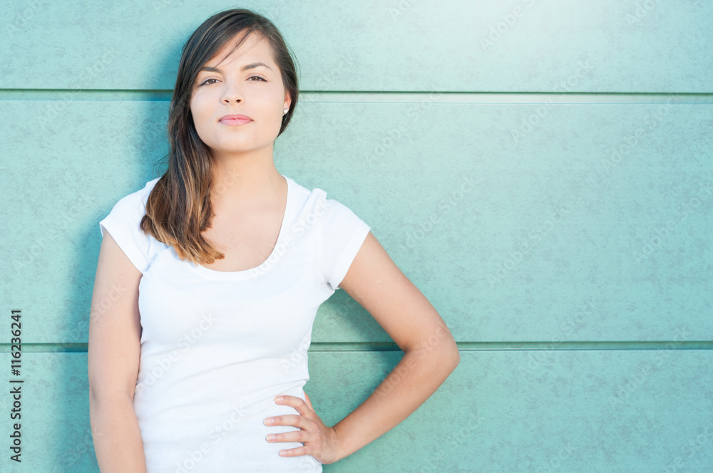 Beautiful casual woman posing with hand on waist Beautiful casual woman posing with hand on waist