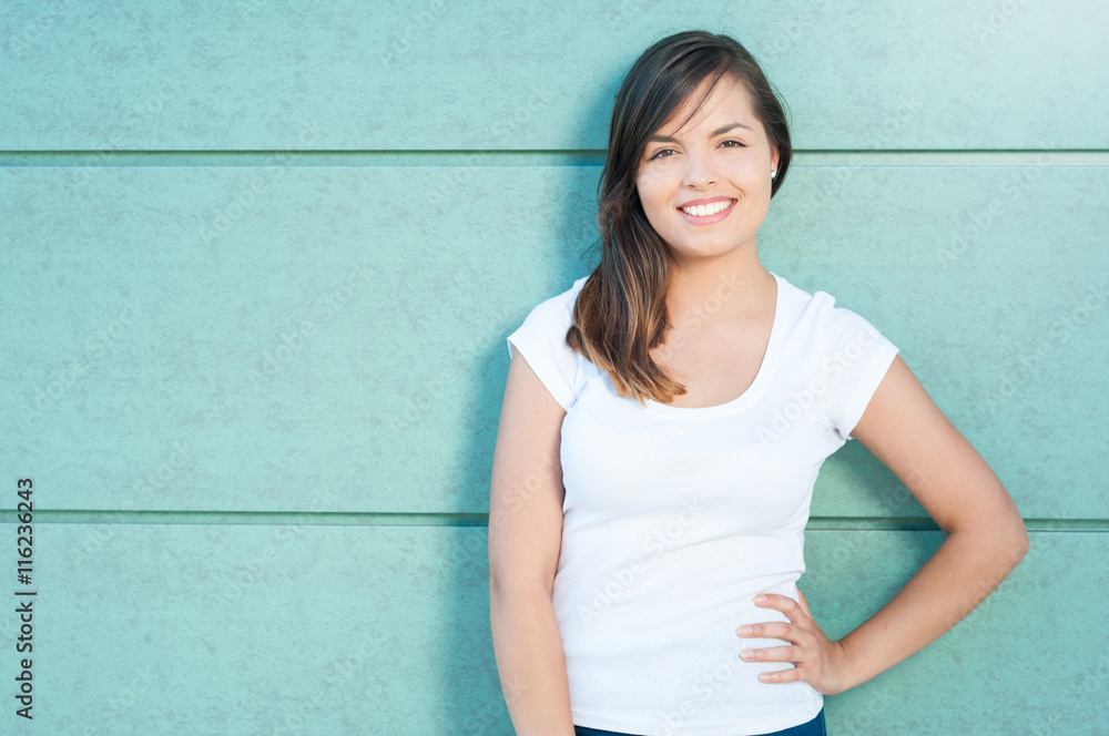 Portrait of girl smiling with hand on waist Portrait of girl smiling with hand on waist
