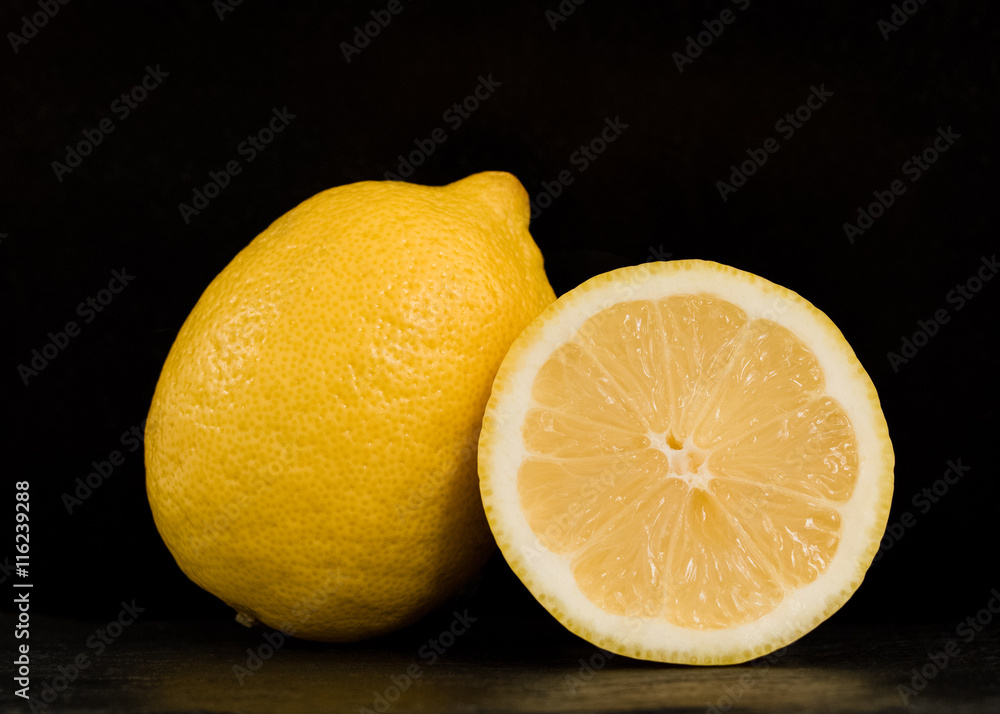 Half lemon on a black background Half lemon on a black background