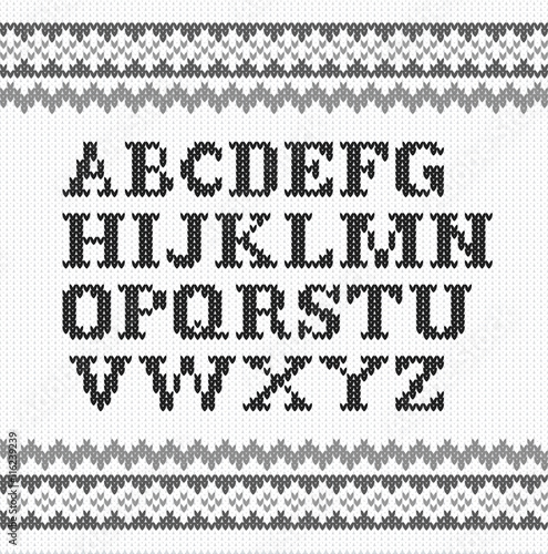 schwarzes gestricktes Alphabet auf weiß 