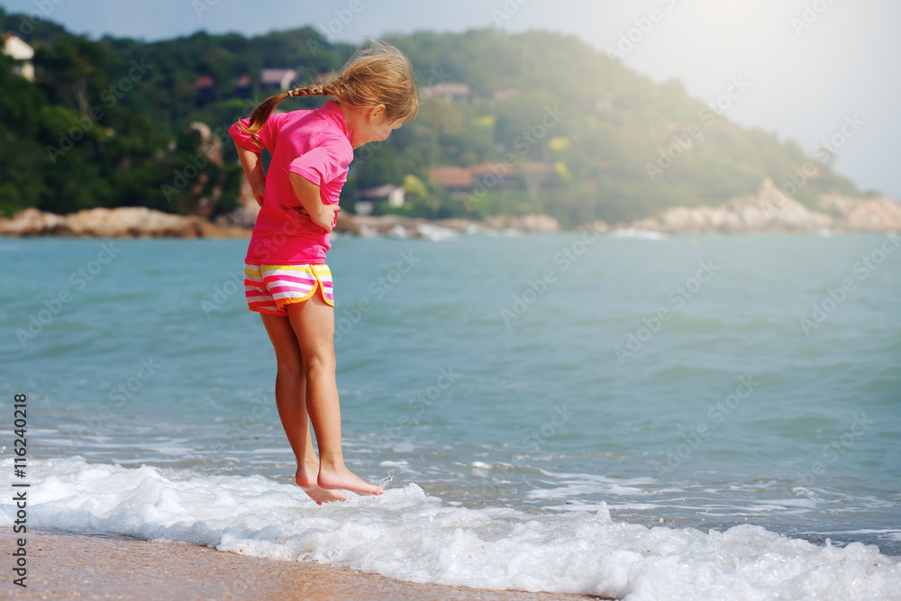 Fototapeta premium Happy child playing in sea.