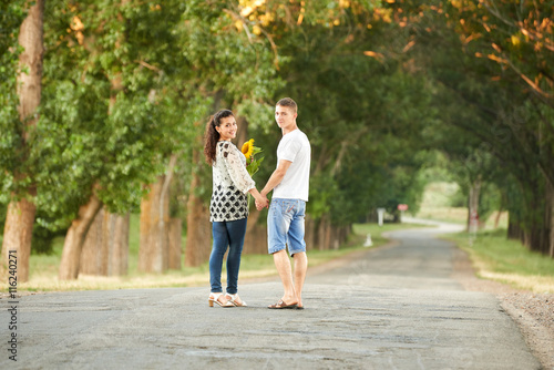 happy young couple walk on country road outdoor, romantic people concept, summer season © soleg