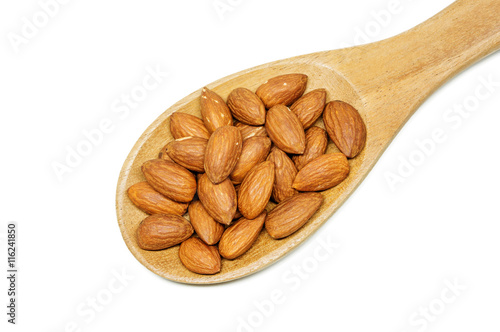 almonds in the wood spoon on white background.