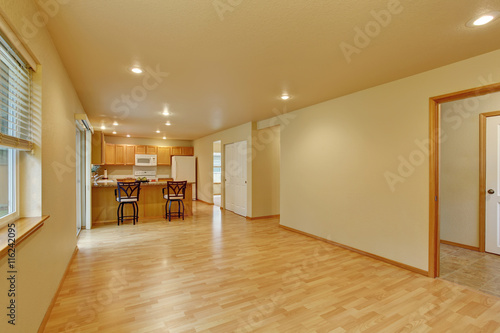 Spacious empty room with hardwood floor