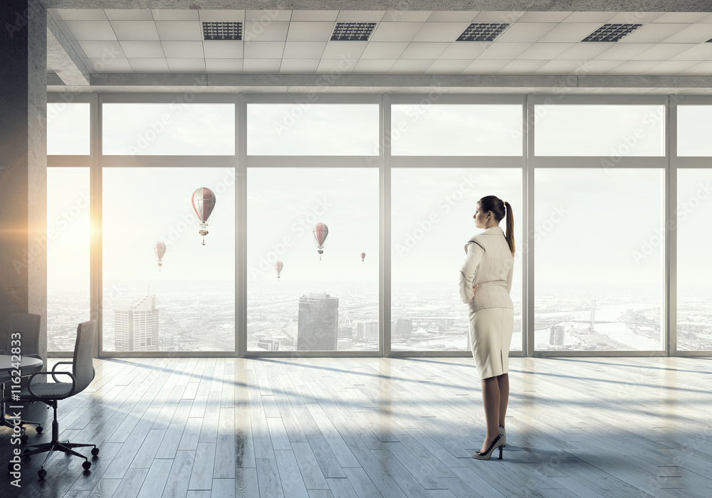 Businesswoman in modern office interior . Mixed media Businesswoman in modern office interior . Mixed media