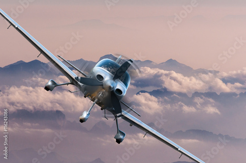 Privat light airplane or aircraft fly on mountain background. VIP travel concept