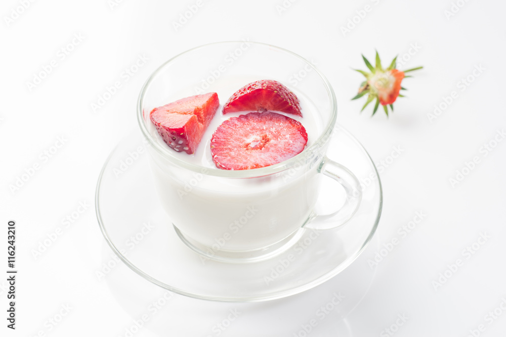 Milk fruit dessert with red strawberries in a cup. Milk fruit dessert with red strawberries in a cup.