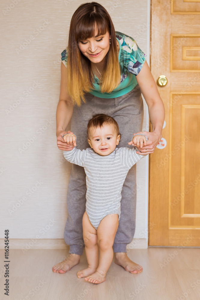 Mother and baby legs. First steps. Mother and baby legs. First steps.