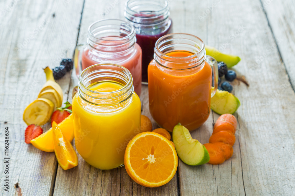 Slection of fresh fruit juices in jars Slection of fresh fruit juices in jars