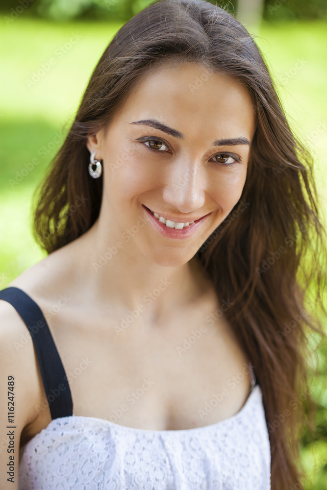 Closeup portrait of a happy young woman smiling Closeup portrait of a happy young woman smiling