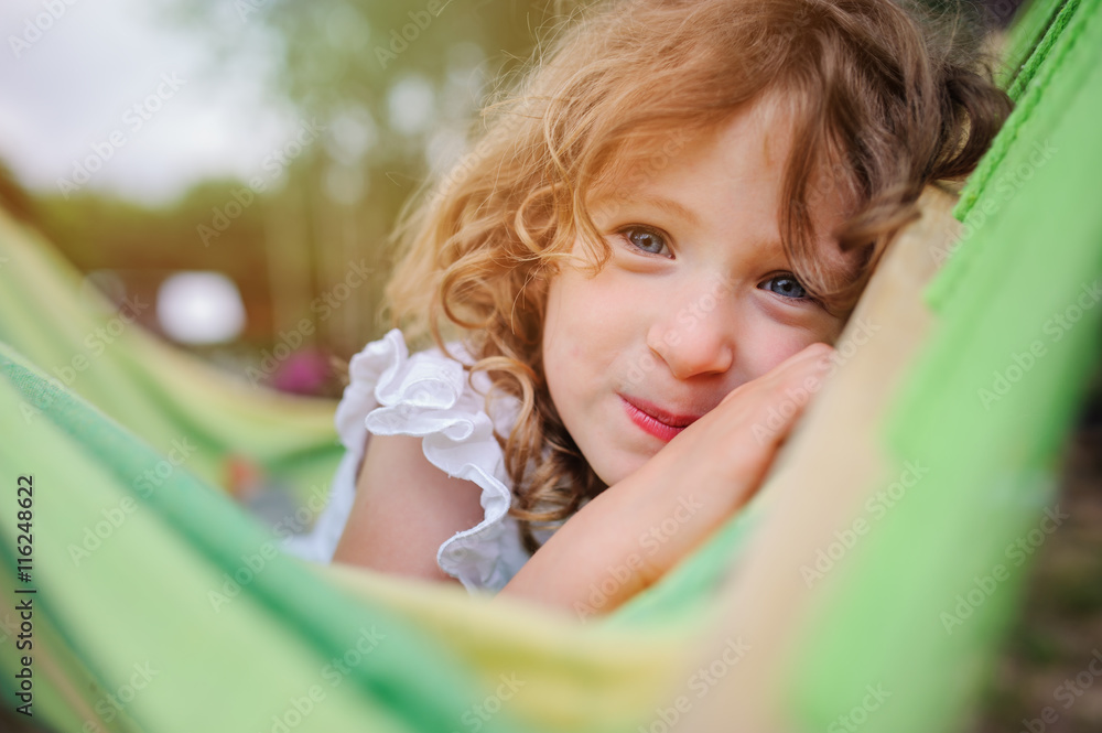 happy child girl relaxing in hammock in summer forest, summer camp, traveling on vacations happy child girl relaxing in hammock in summer forest, summer camp, traveling on vacations