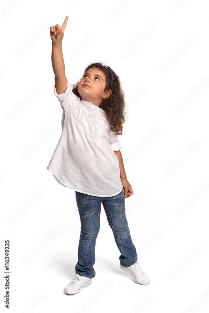 Full length portrait of a happy little girl on white background pointing Full length portrait of a happy little girl on white background pointing