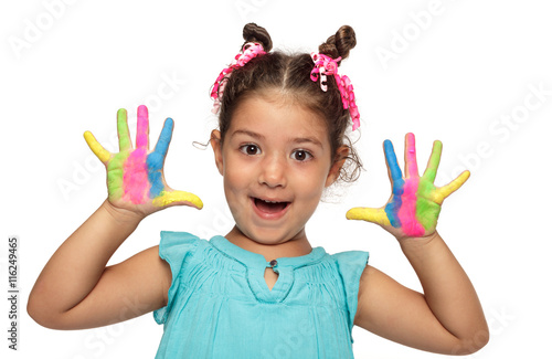 Cute girl showing her colorful hands smiling