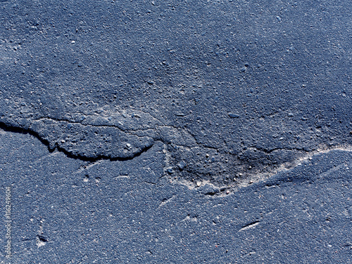 Abstract cracked asphalt texture.