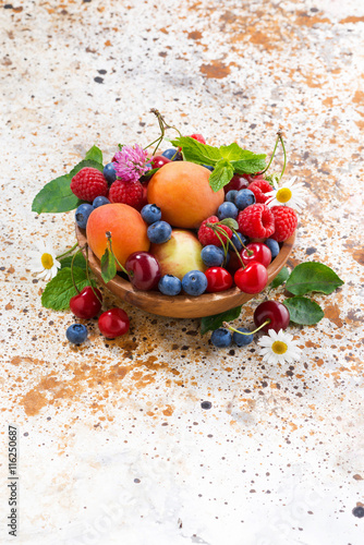 bowl with seasonal fruit and berries  vertical