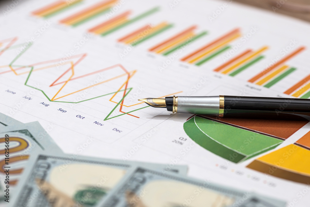 business graph with money and pen business graph with money and pen