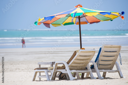 beach chair with colorful umbrella