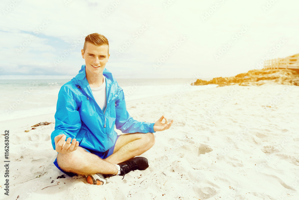 Man training on beach outside