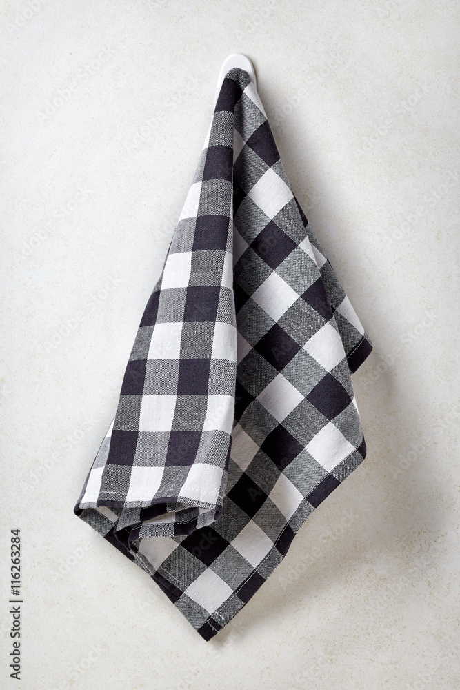 Clean and soft towel hanging at bathroom wall Clean and soft towel hanging at bathroom wall