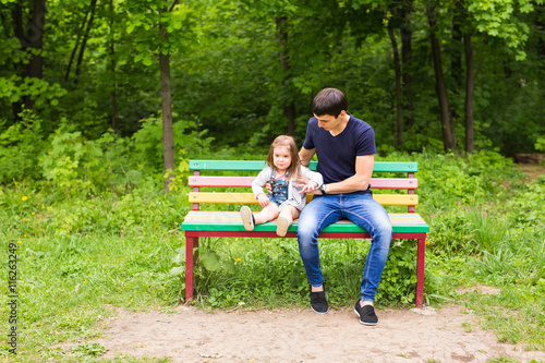 loving father with a daughter in the park