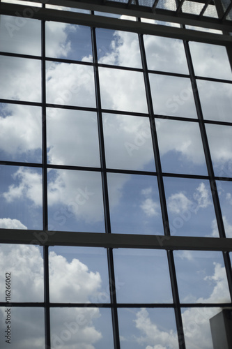 Modern residential window with clouds