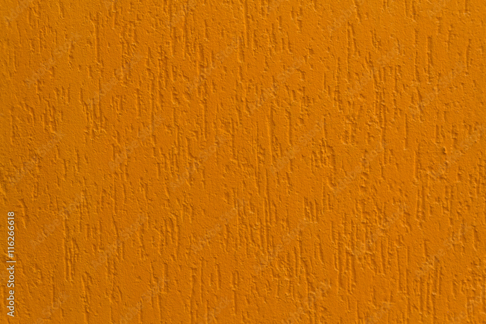 Naklejka premium Bright orange stucco wall. Backgrounds and textures