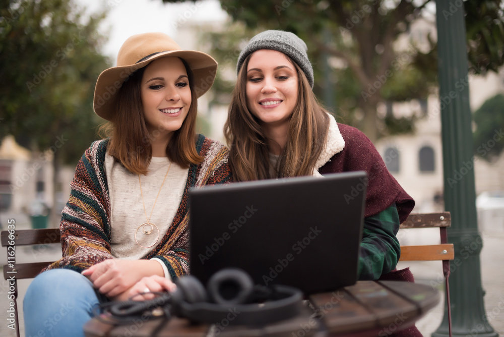 Friends in laptop on street