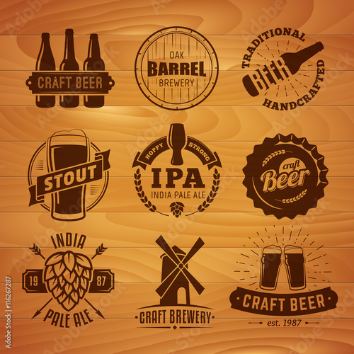Set of vector craft beer logos and badges. Retro beer labels on vintage wooden background