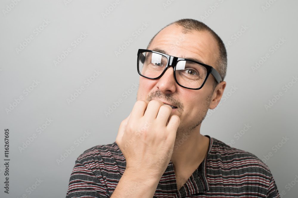 emotional man in glasses