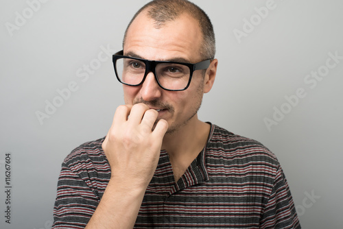 emotional man in glasses