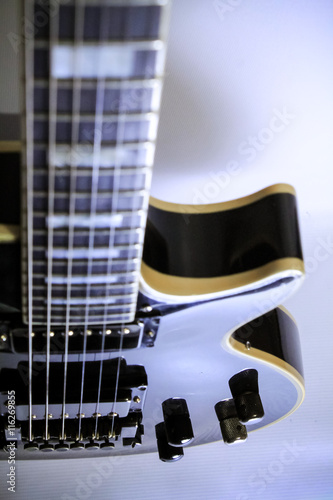 Black electric guitar on white
