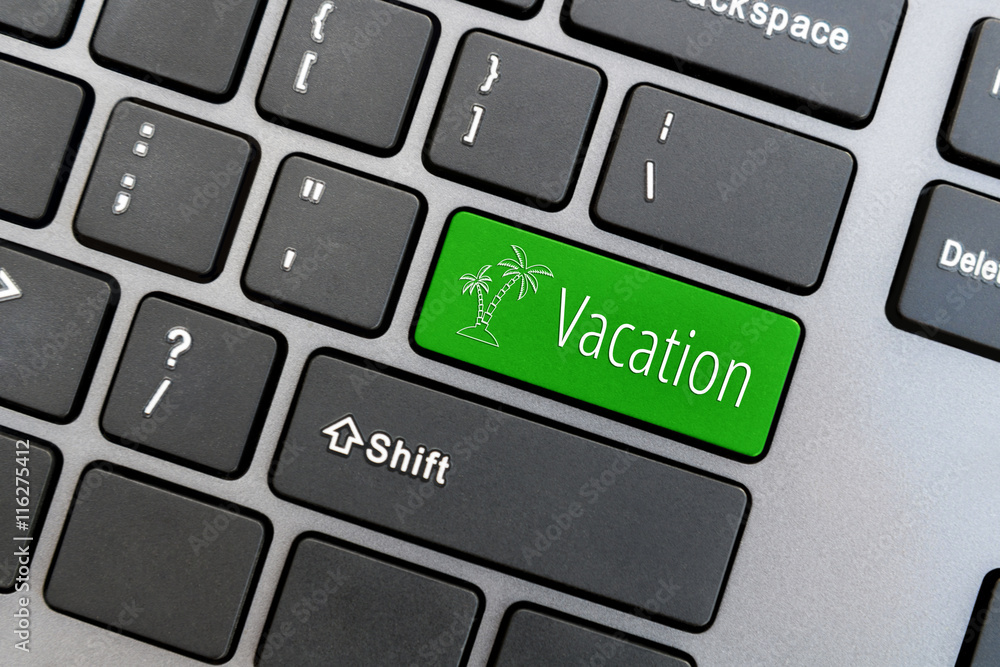 Computer keyboard with palm tree icon and word Vacation on green enter button. Online travel and holiday concept. Computer keyboard with palm tree icon and word Vacation on green enter button. Online travel and holiday concept.
