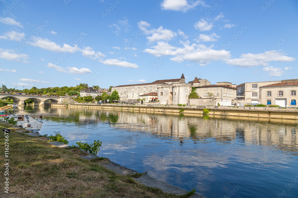 Cognac, France. Quay of the Charente River. From left to right: the bridge, the castle of Valois (X - XV centuries) now house Otard Cognac, the city Gate of St. James  with towers (1499)