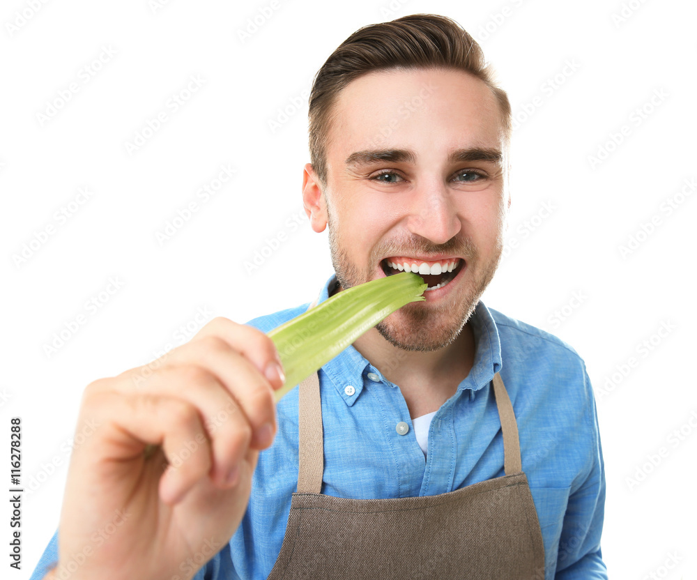 Handsome man eating celery, isolated on white Stock Photo Adobe Stock