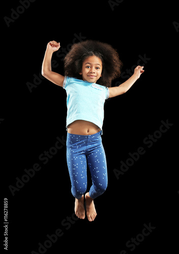 Happy African girl jumping ...