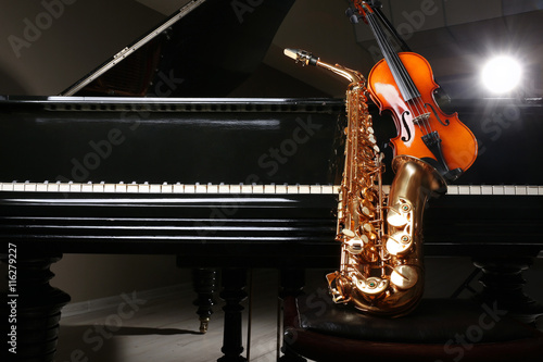 Violin with saxophone and piano, closeup