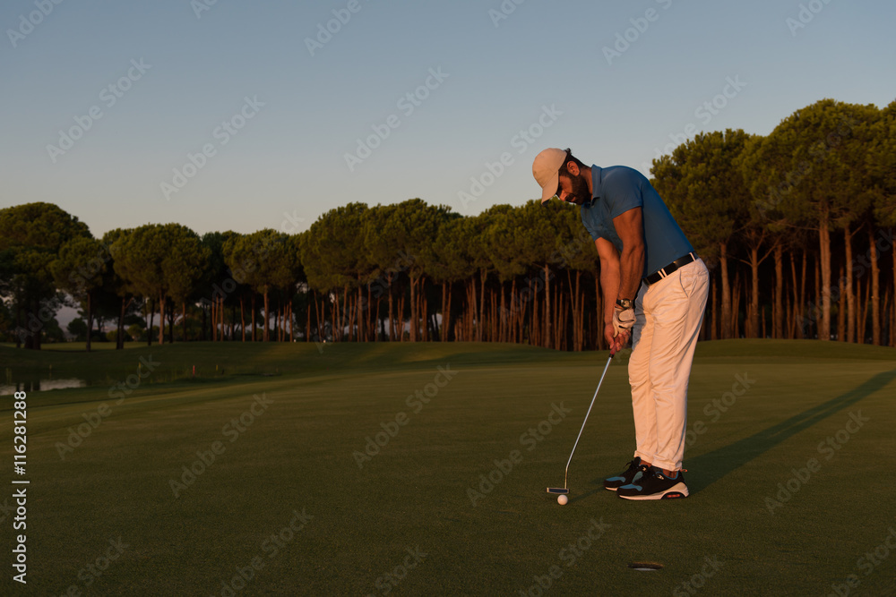 Fototapeta premium golfer hitting shot at golf course