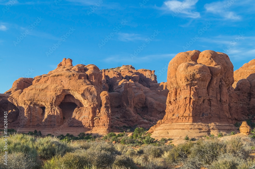 Scenic view of the Arches National park against blue sky. Scenic view of the Arches National park against blue sky.