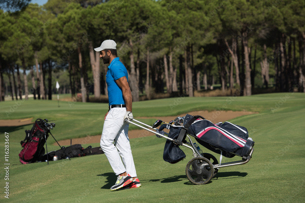 golf player walking with wheel bag golf player walking with wheel bag