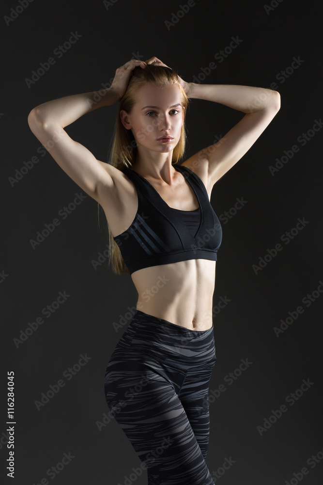 Beautiful sexy blonde woman perfect athletic slim figure engaged in yoga,  exercise or fitness, lead healthy lifestyle, eats right, dressed in  comfortable casual clothes sport pilates diet body shape Photos