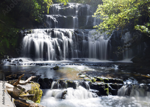 A long exposure shot of Purakaunui Waterfall.