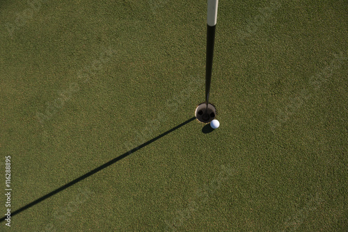 top view of golf ball in the hole