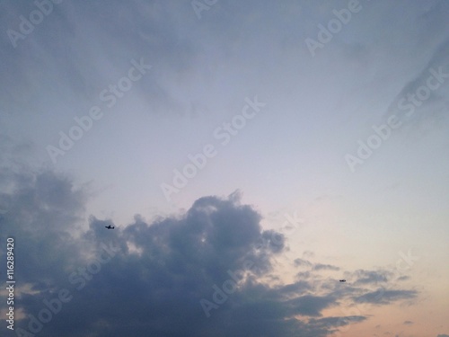 two airplanes and sunset sky