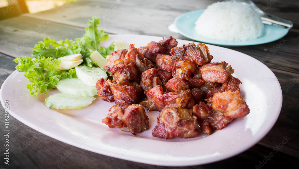 juicy fried pork ribs on plate