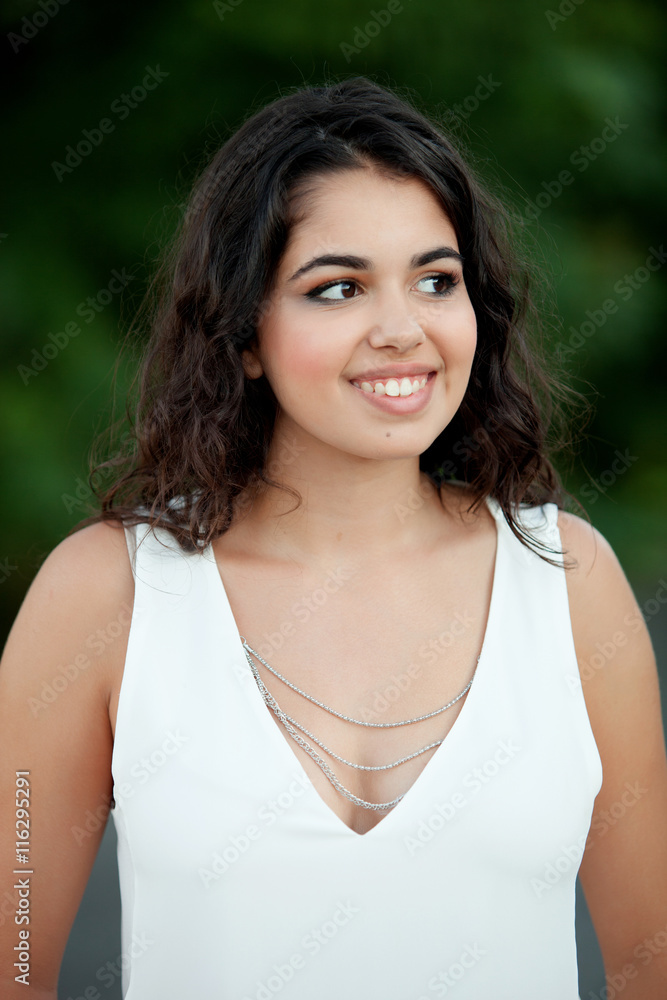 Beautiful brunette girl relaxing in the park