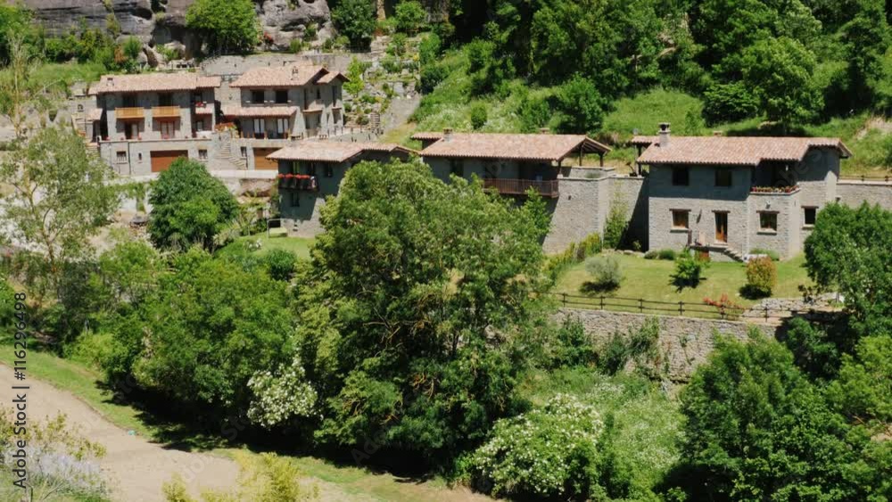 A number of old houses in the town of Rupit, Catalonia. A popular tourist attraction and Spain A number of old houses in the town of Rupit, Catalonia. A popular tourist attraction and Spain